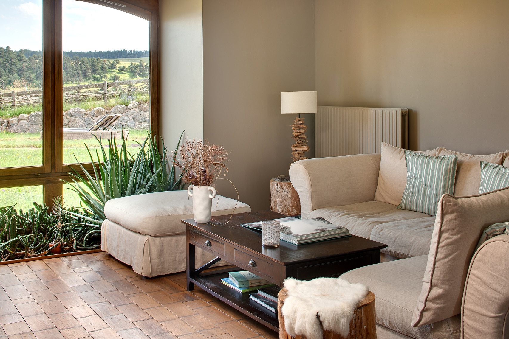 View from inside, in the lounge, at instants d'Absolu eco-lodge overlooking the wild landscapes of Cantal, France.